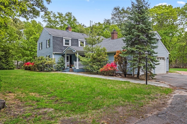7 E Gate Ln, Setauket, NY 11733 - dutch colonial featuring a porch, a chimney, a front yard, asphalt driveway, and roof with shingles
