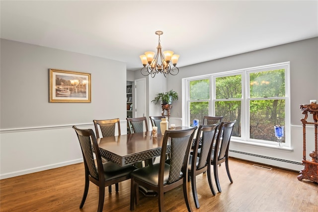 7 E Gate Ln, Setauket, NY 11733 - dining room featuring a chandelier, light wood-style floors, a baseboard radiator, and baseboards