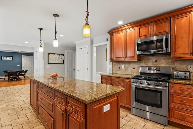 7 E Gate Ln, Setauket, NY 11733 - kitchen featuring appliances with stainless steel finishes, decorative backsplash, a kitchen island, dark stone counters, and recessed lighting