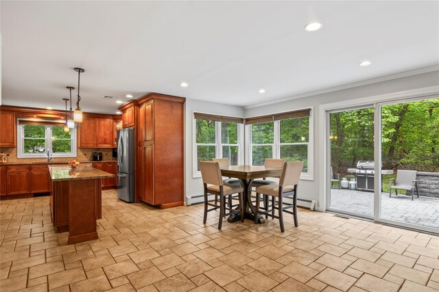 7 E Gate Ln, Setauket, NY 11733 - kitchen with freestanding refrigerator, healthy amount of natural light, decorative backsplash, a baseboard radiator, and recessed lighting