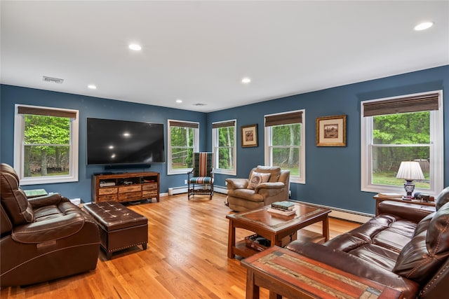 7 E Gate Ln, Setauket, NY 11733 - living room featuring baseboard heating, light wood-style flooring, recessed lighting, and baseboards