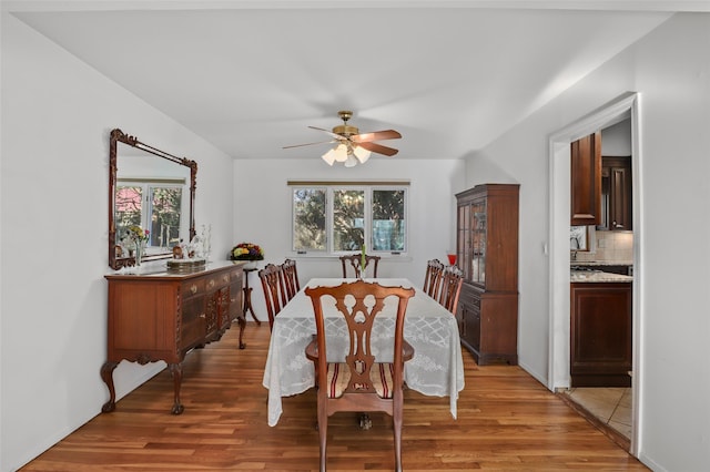 dining space featuring light wood-style floors and ceiling fan