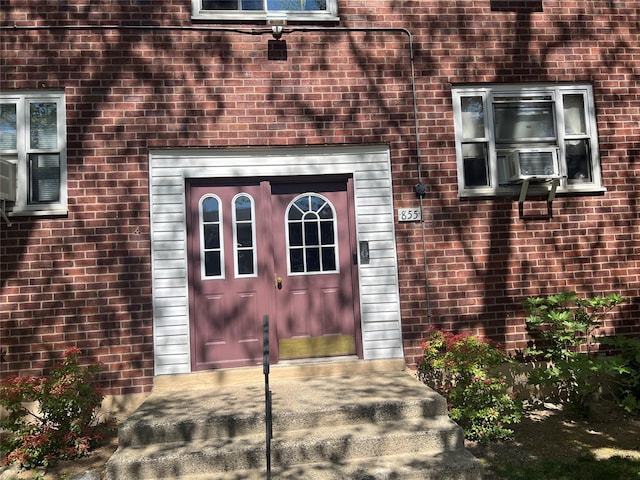 property entrance with brick siding