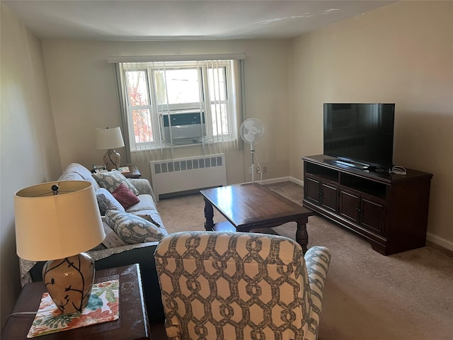 living area with carpet floors, baseboards, radiator heating unit, and cooling unit