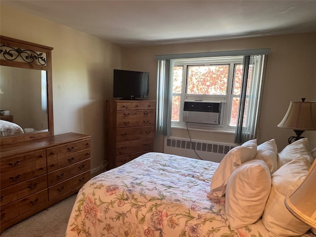 bedroom with radiator heating unit and carpet floors