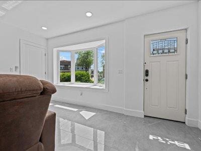 66-39 Jay Ave, Maspeth, NY 11378 - foyer entrance featuring baseboards, recessed lighting, and light carpet