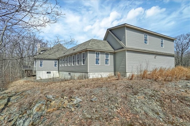 238 Deer Hollow Rd, Poughquag, NY 12570 - back of house with roof with shingles and a chimney