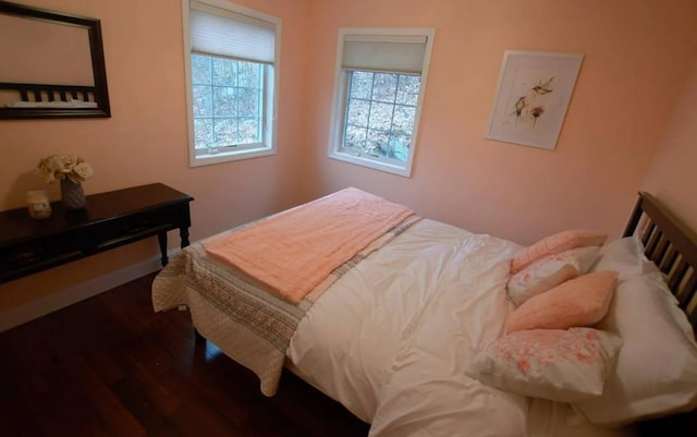 bedroom featuring wood finished floors