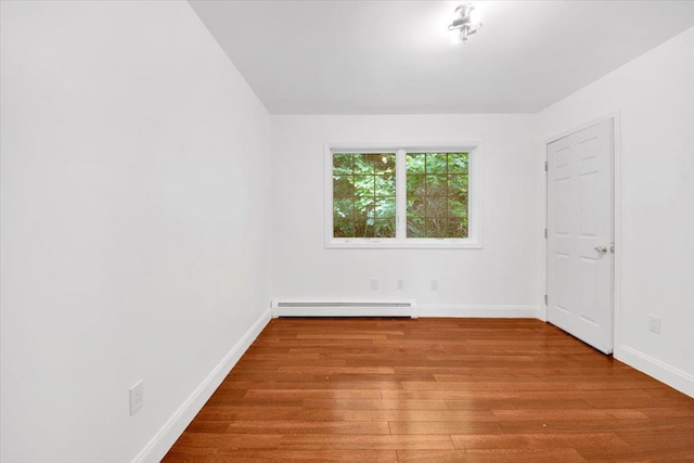 254 Farm To Market Rd, Brewster, NY 10509 - unfurnished room featuring a baseboard heating unit and wood finished floors