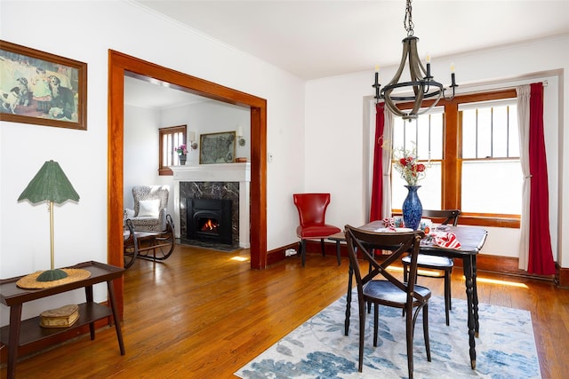 7365 S Broadway, Red Hook, NY 12571 - dining area with an inviting chandelier, ornamental molding, wood finished floors, and a healthy amount of sunlight