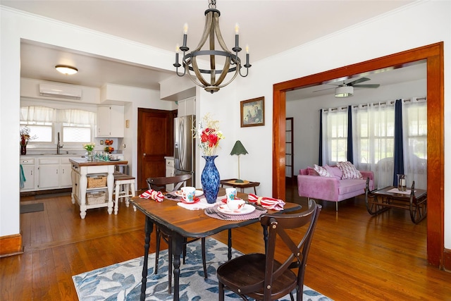 7365 S Broadway, Red Hook, NY 12571 - dining area featuring an AC wall unit, dark wood finished floors, ornamental molding, and ceiling fan with notable chandelier