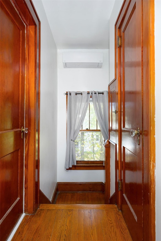 7365 S Broadway, Red Hook, NY 12571 - hall with baseboards, a wall mounted air conditioner, and wood finished floors