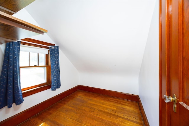 7365 S Broadway, Red Hook, NY 12571 - additional living space with baseboards, vaulted ceiling, and wood finished floors