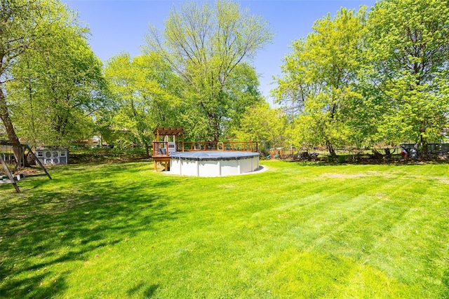 7365 S Broadway, Red Hook, NY 12571 - view of yard with an outdoor structure, a storage shed, and a covered pool