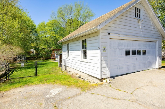 7365 S Broadway, Red Hook, NY 12571 - view of property exterior featuring a lawn, a gate, a detached garage, fence, and an outdoor structure