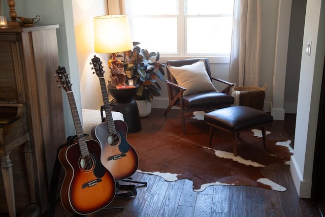 sitting room featuring baseboards and wood finished floors
