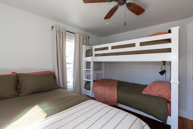 bedroom featuring a ceiling fan and wood finished floors