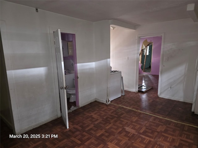 spare room featuring baseboards