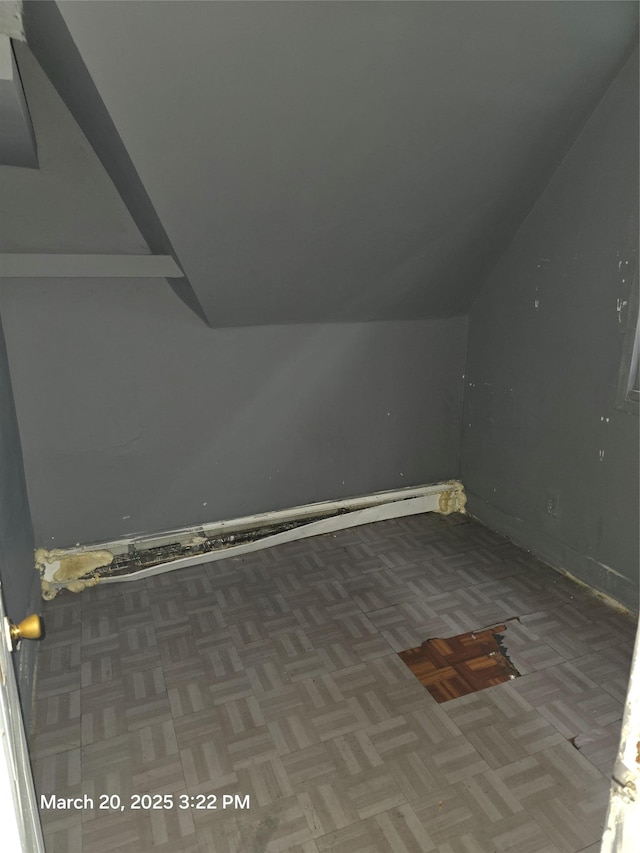 additional living space with vaulted ceiling