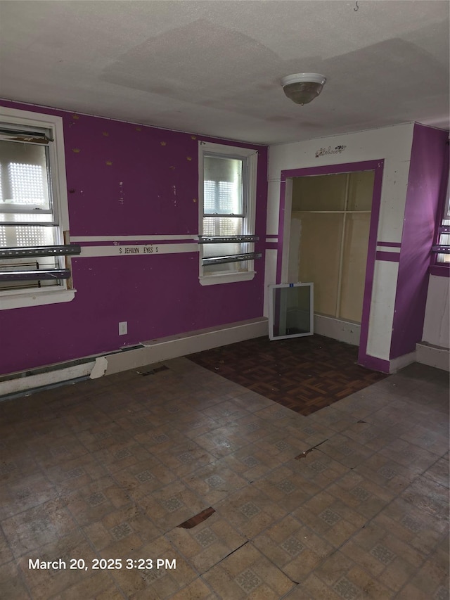 interior space featuring baseboards