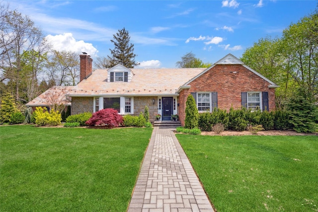 26 Woodgreen Ln, East Hills, NY 11577 - view of front facade with a chimney, a front lawn, a high end roof, and stone siding