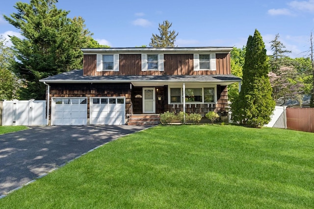 126 Carley Ave, Huntington, NY 11743 - view of front of property with driveway, a gate, covered porch, board and batten siding, and an attached garage