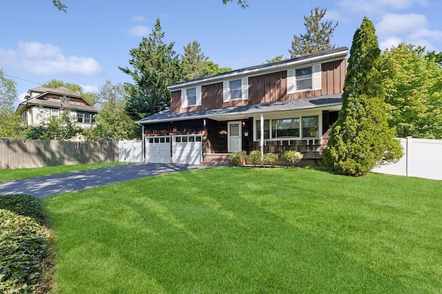 126 Carley Ave, Huntington, NY 11743 - view of front of home with asphalt driveway, covered porch, and board and batten siding