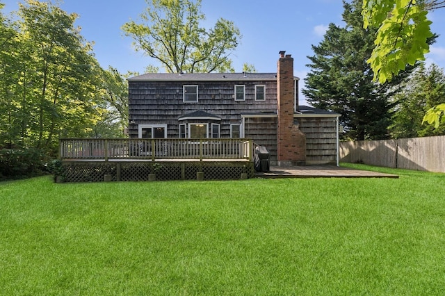 126 Carley Ave, Huntington, NY 11743 - rear view of house featuring a deck and a chimney
