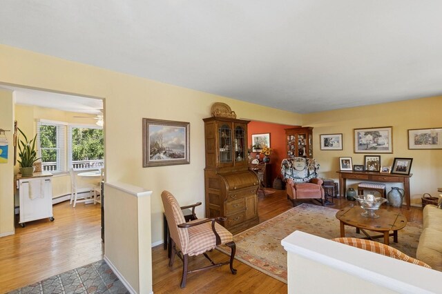 126 Carley Ave, Huntington, NY 11743 - living room featuring light wood-style floors and a baseboard radiator