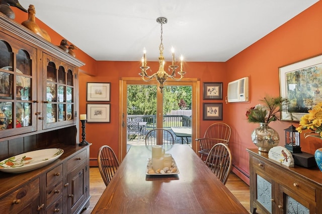 126 Carley Ave, Huntington, NY 11743 - dining room with light wood-type flooring, a chandelier, and a baseboard radiator