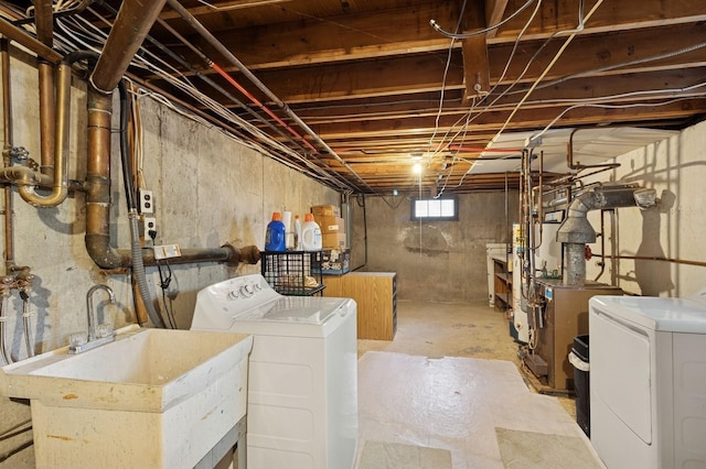 126 Carley Ave, Huntington, NY 11743 - basement featuring a sink, separate washer and dryer, and water heater