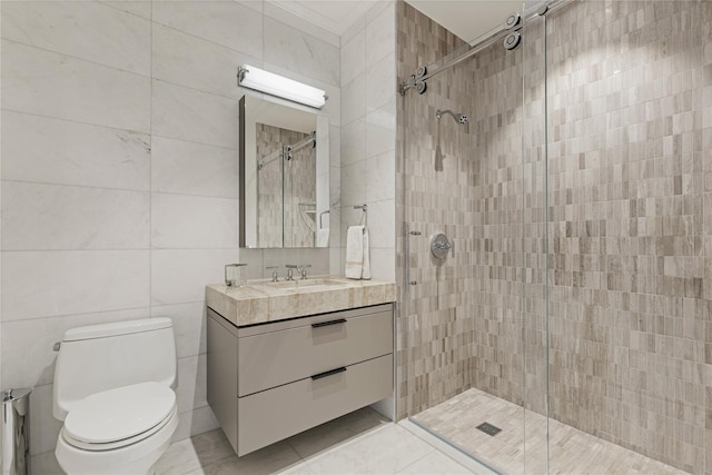 full bath with vanity, ornamental molding, toilet, tile walls, and a shower stall