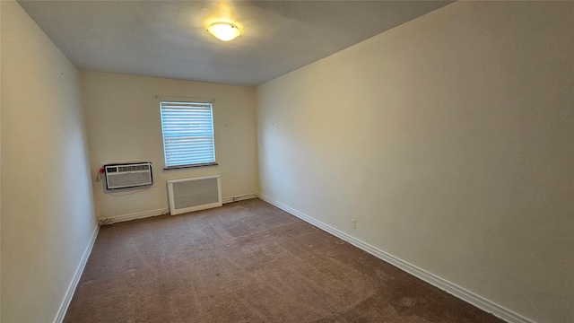 unfurnished room with dark carpet, baseboards, and a wall unit AC