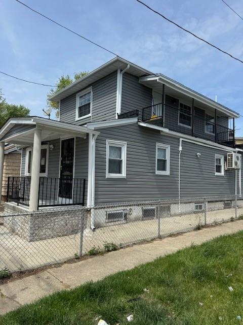 1161 E 88th St, Brooklyn, NY 11236 - view of side of property with a porch and a balcony