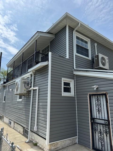 1161 E 88th St, Brooklyn, NY 11236 - view of side of property featuring a balcony and a cooling unit