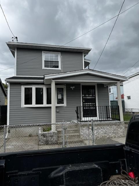 1161 E 88th St, Brooklyn, NY 11236 - view of front of house featuring covered porch and a fenced front yard