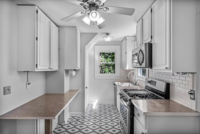 119 Western Hwy, West Nyack, NY 10994 - kitchen featuring a sink, appliances with stainless steel finishes, tasteful backsplash, and ceiling fan