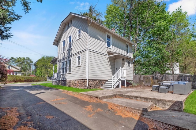 119 Western Hwy, West Nyack, NY 10994 - exterior space with fence, a chimney, an outdoor hangout area, and a patio area