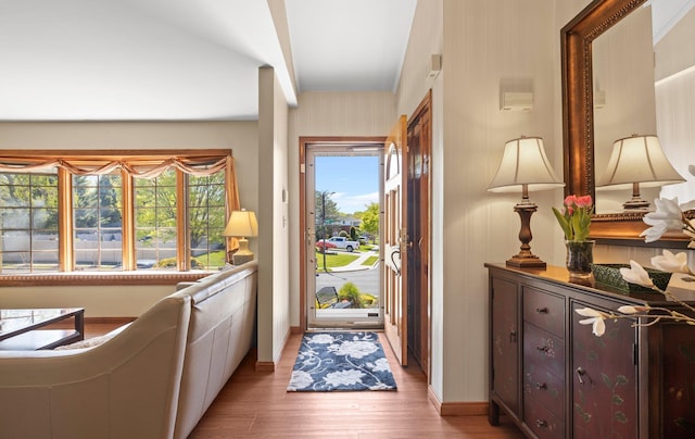 entryway featuring baseboards and light wood-style flooring
