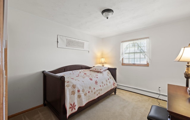 carpeted bedroom featuring crown molding and a baseboard heating unit