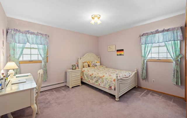 bedroom featuring multiple windows, carpet, and a baseboard heating unit