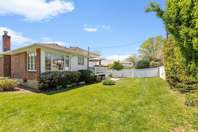 view of yard with a fenced backyard