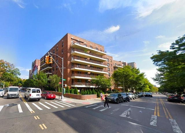 view of property featuring uncovered parking