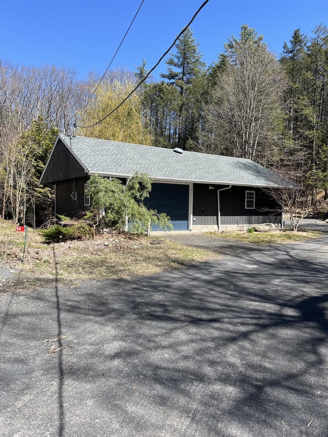 view of front of house with roof with shingles