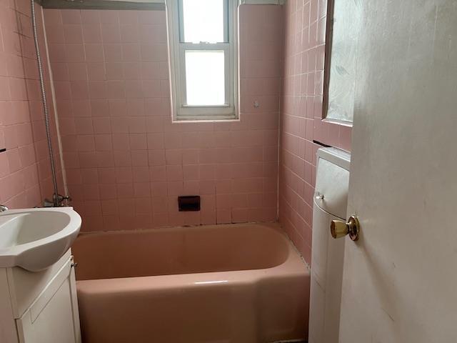bathroom with tub / shower combination and vanity