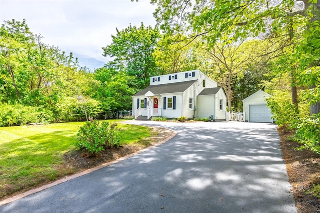 352 Gibbs Pond Rd, Nesconset, NY 11767 - view of front of property with an outbuilding, a front lawn, a detached garage, and view of scattered trees