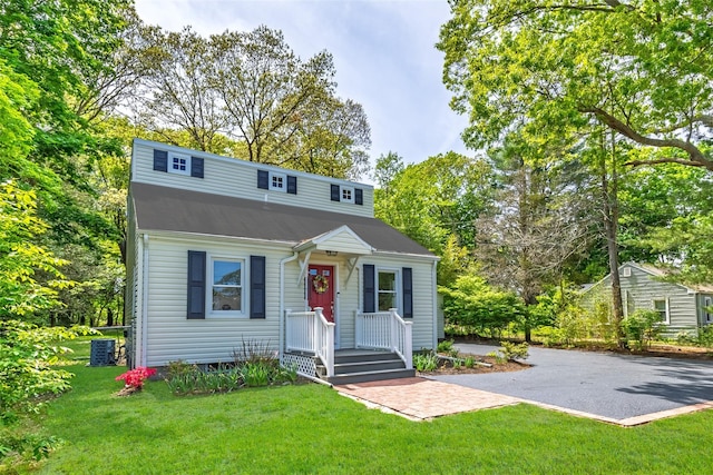 352 Gibbs Pond Rd, Nesconset, NY 11767 - bungalow-style home with a front yard and central air condition unit