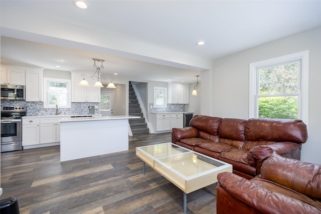 352 Gibbs Pond Rd, Nesconset, NY 11767 - living area with recessed lighting, dark wood-type flooring, plenty of natural light, and stairway