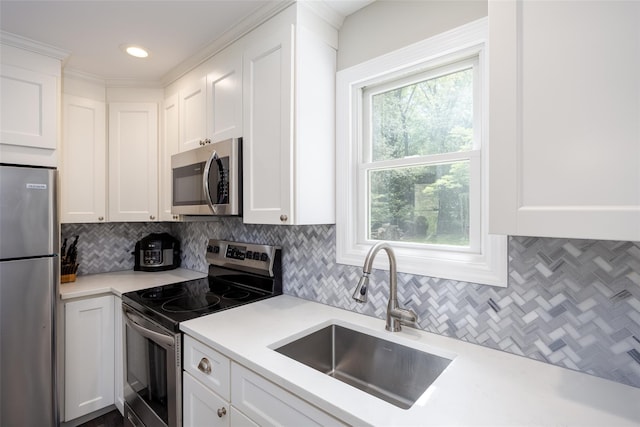 352 Gibbs Pond Rd, Nesconset, NY 11767 - kitchen with appliances with stainless steel finishes, a sink, decorative backsplash, white cabinets, and recessed lighting