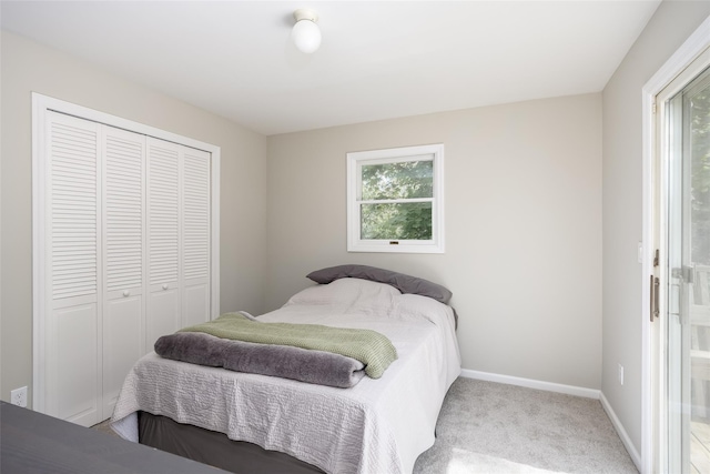 352 Gibbs Pond Rd, Nesconset, NY 11767 - bedroom with multiple windows, a closet, baseboards, and carpet